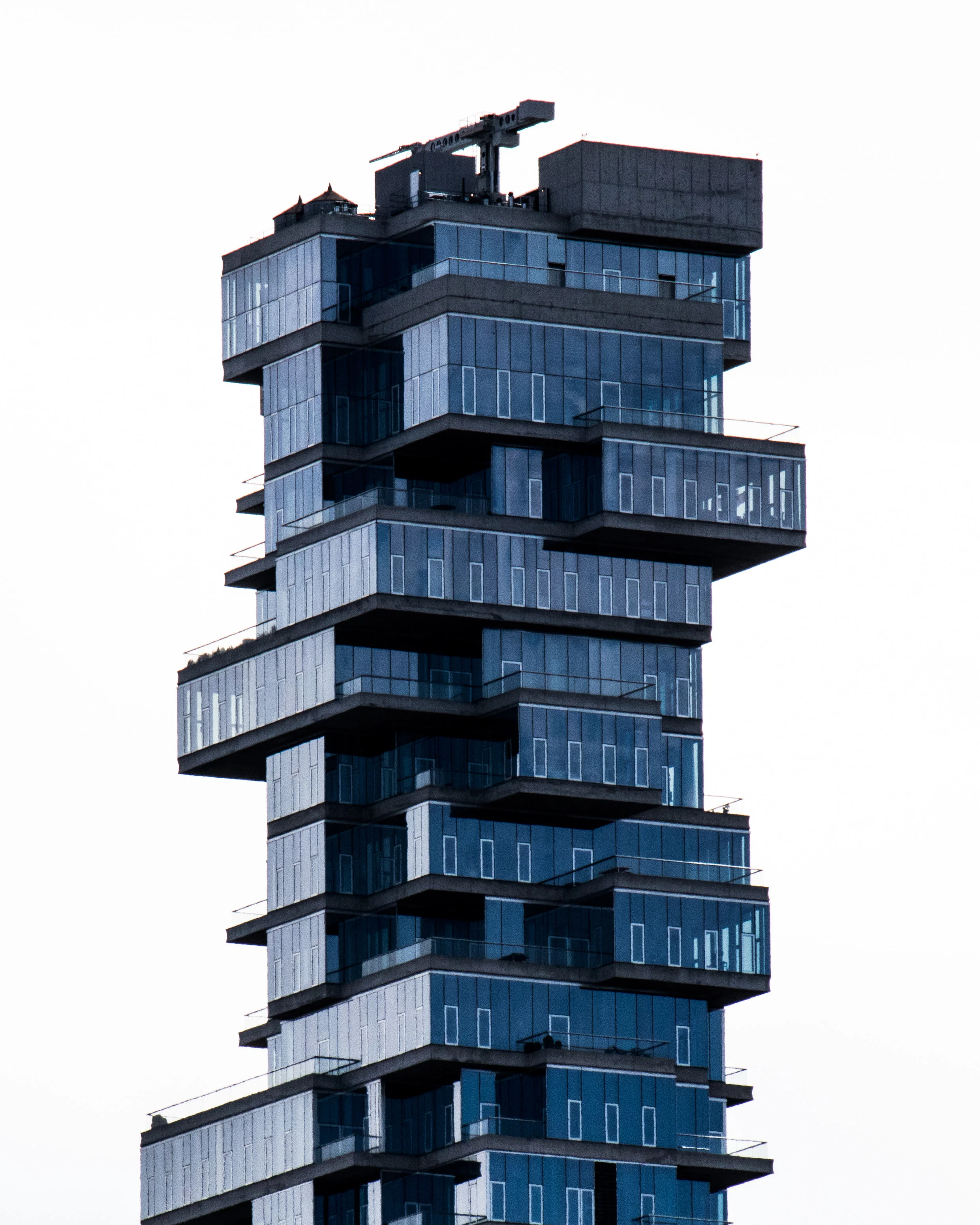The stacked glass floors of 56 Leonard Street against a white sky